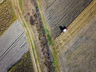 Aerial view of Tractor harrowing soil