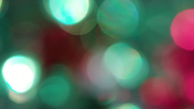 The Circles Bokeh stock video features a circle rotation in a clockwise direction of blurred green and red lights. You can use it as an overlay for creative video effects, artistic videos, and as a