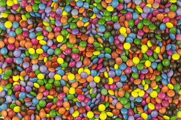 Fototapeta na wymiar background of multicolored sugar coated candies