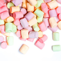 Colorful mini marshmallows isolated on white background, macro. Fluffy marshmallows texture and pattern. High Resolution image