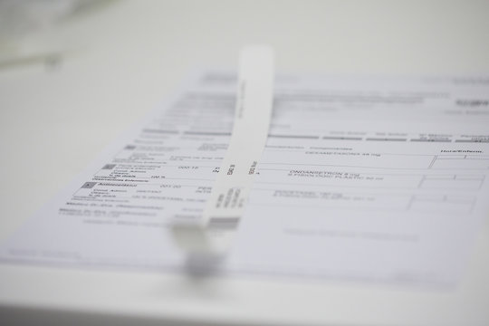 Close-up of a chemotherapy prescription and hospital patient tag