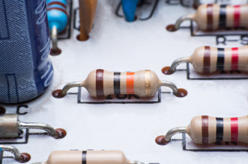 Closeup electronic hardware .Resistor on the white circuit board