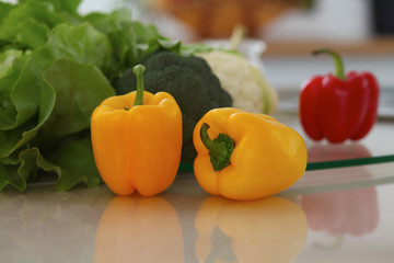 Kitchen interiors. Many vegetables and other meal at glass table are ready for been cooked soon