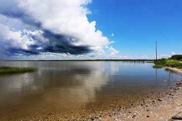cloud with dark reflected in water