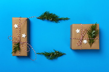 Christmas or New Year presents and Christmas toys on a blue background. Copy space, top view