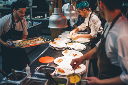Several cooks working.