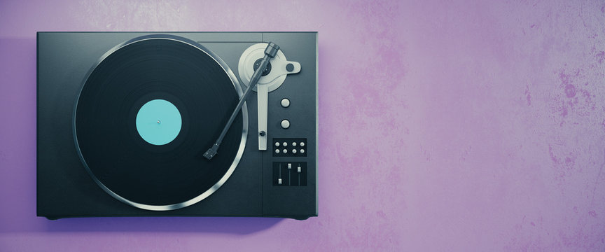 Vinyl record player on purple background