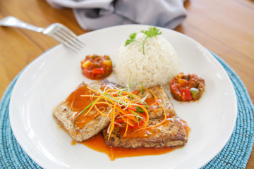 Fish fillets served with rice