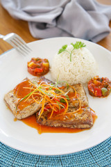 Fish fillets served with rice
