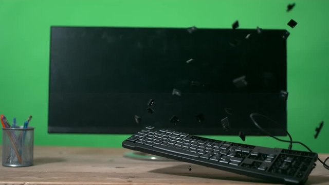  Unrecognizable angry businessman smashing computer keyboard slowmo