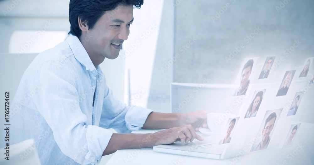 Poster composite image of happy man using laptop while having a coffee