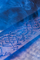 Laser makes engraving on leather belt 