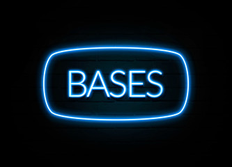 Bases  - colorful Neon Sign on brickwall