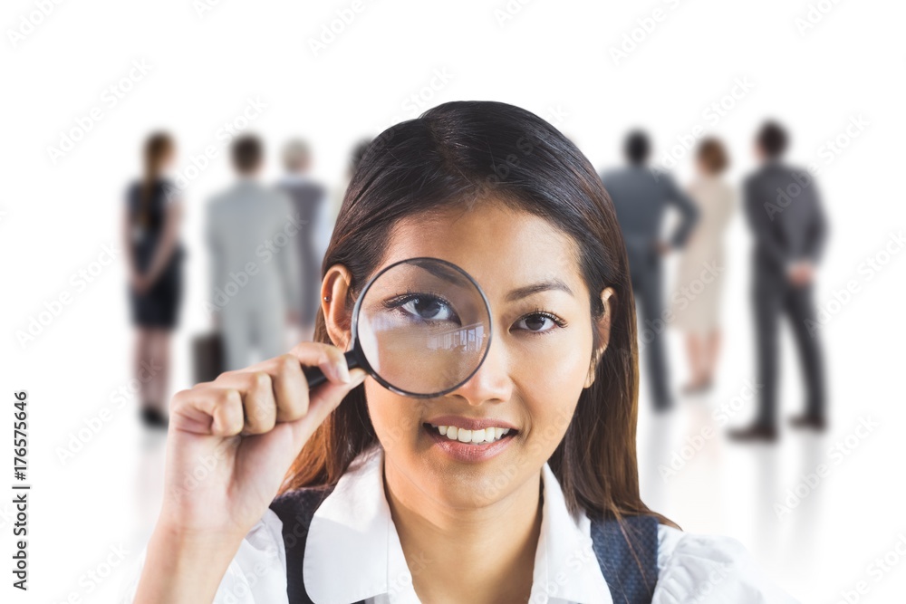 Sticker composite image of businesswoman looking through magnifying