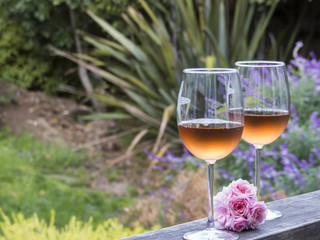 Two glasses of rosé with pink flowers