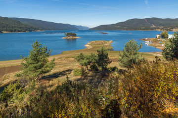 Fototapeta na wymiar Amazing Autumn Landscape of Dospat Reservoir, Smolyan Region, Bulgaria