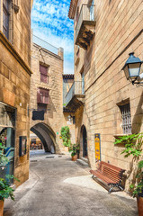 Scenic alley inside Poble Espanyol, Barcelona, Catalonia, Spain