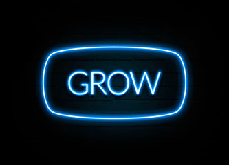 Grow  - colorful Neon Sign on brickwall