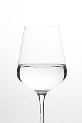 Wineglass of water, isolated on a white background