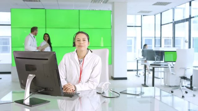  Healthcare worker assisting a patient over the phone, with green background