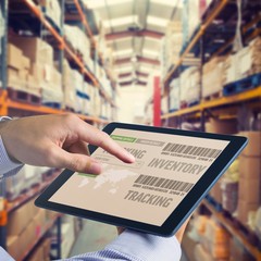 Composite image of man using tablet pc 