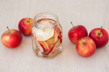 Drink of red apples on the table