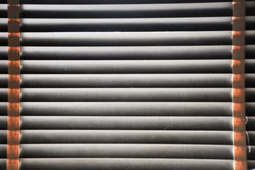 Obraz premium Background of wooden blinds and light from outside of window