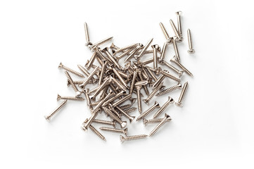 Heap of metal wood screw on white background