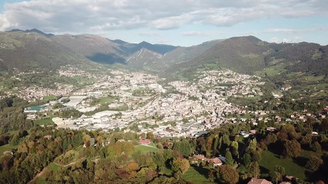 4K Drone aerial view to the villages of Leffe, Gandino, Peia and Cazzano Sant Andrea, located at Gandino Valley, Bergamo, Italy during autumn season