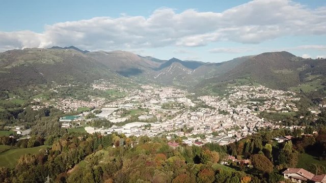 4K Drone aerial view to the villages of Leffe, Gandino, Peia and Cazzano Sant Andrea, located at Gandino Valley, Bergamo, Italy during autumn season