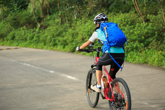 cyclist cycling mountain bike on trail