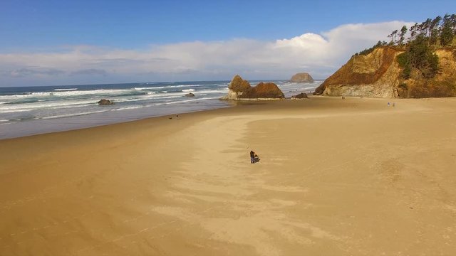 Couple Walking Dog Oregon Coast Beach Pacific Ocean