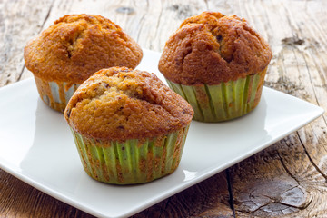 Muffins on a wooden table