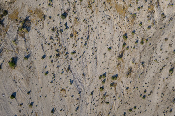 Empty stretch of dry desert sand viewed from above in American southwest.