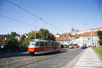 Naklejka na ściany i meble Czechia people and foreigner travelers use retro tramway got to travel and working with traffic road near Prague castle