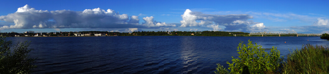 Fototapeta na wymiar Kostroma. Afternoon on the embankment of the Volga river. Panorama/Summer, noon. Embankment in Kostroma. Golden ring of Russia. Water landscape, nature, panorama