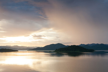 Sunset on the lake and beautiful reflection and sky, Keang Krachan Dam, Petchaburee, Thailand