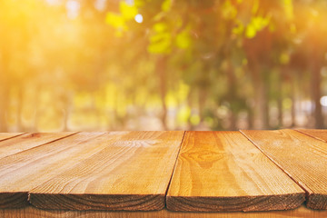 Empty table in front of blurry autumn background. Ready for product display montage