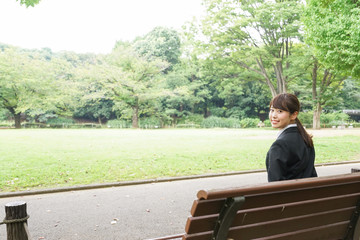Fototapeta premium Business woman sitting on the bench
