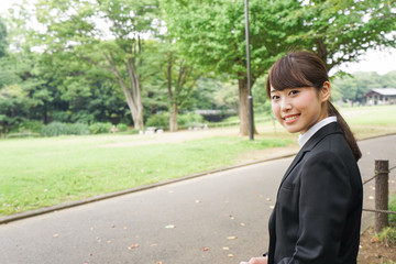 Business woman sitting on the bench