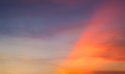 Dramatic sunset and sunrise time when sun light ray shine half the sky on morning evening twilight.