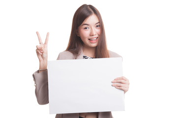 Fototapeta premium Young Asian business woman show victory sign with blank sign.