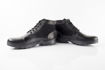Male black leather boot on white background, isolated product.
