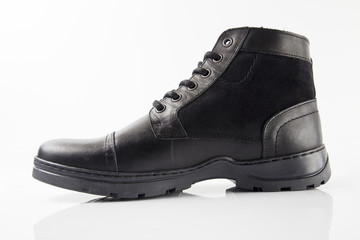 Male black leather boot on white background, isolated product.
