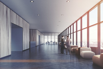Light wooden waiting room, loft office, people