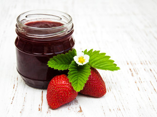 Strawberry jam and fresh strawberries