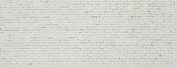 Brick wall painted with white paint.