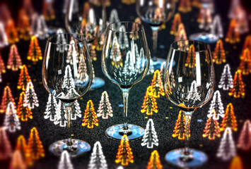 Close-up on three glass on a table, with Christmas tree decoration