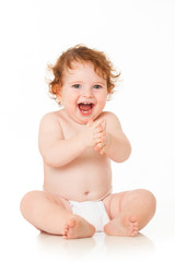 Happy baby boy is sitting on white background