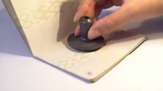 stamp in the passport female hand chop in travel document, customs control, arrival, visa video